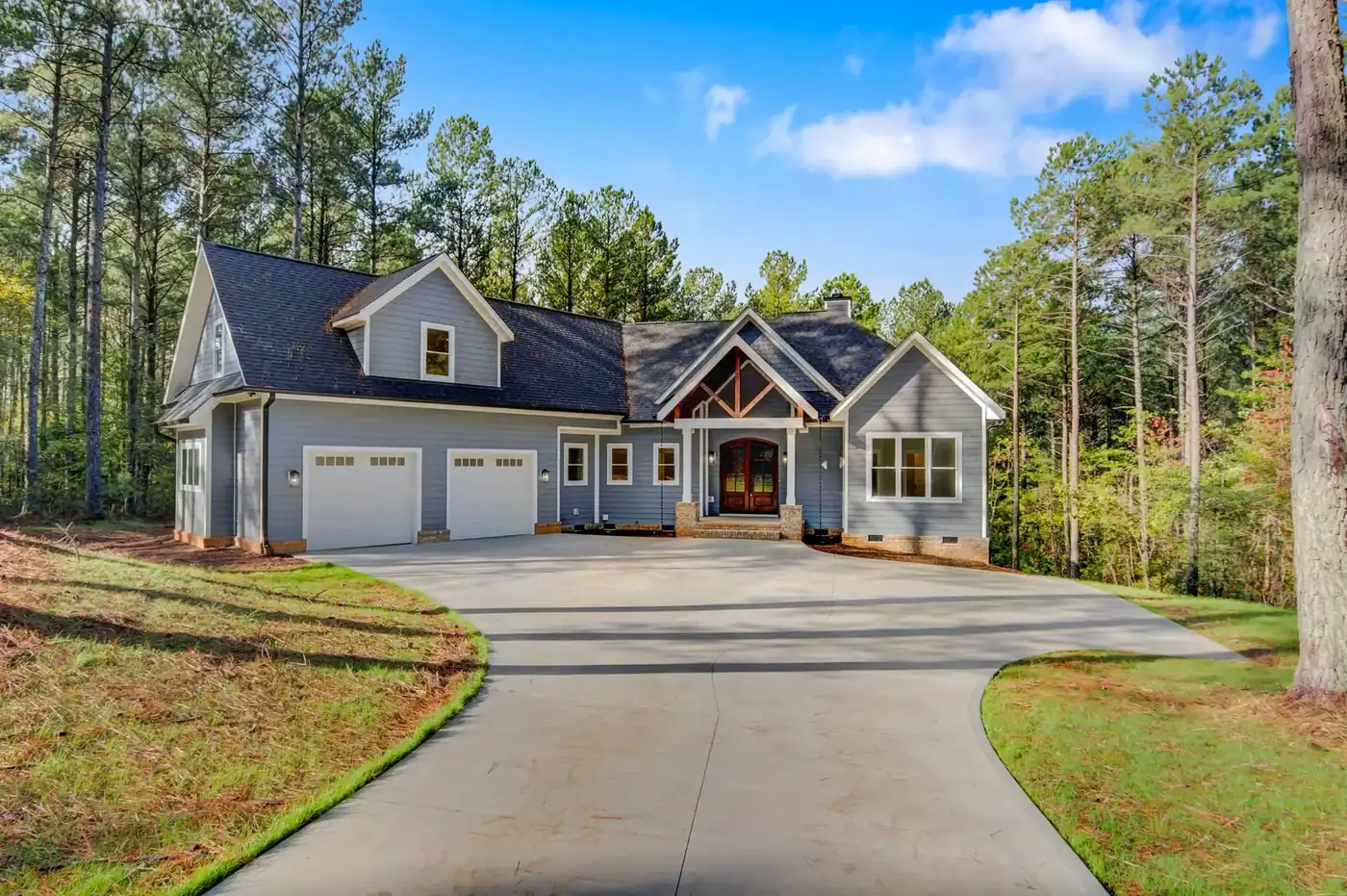 Front entry roofline and timber gable of a home re-roofed by S&S Roofing in Hickory, NC