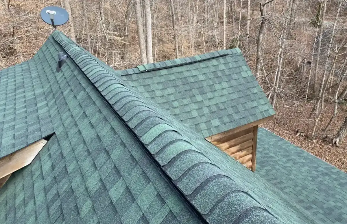 Green roof replacement on a log cabin in the NC Foothills by S&S Roofing