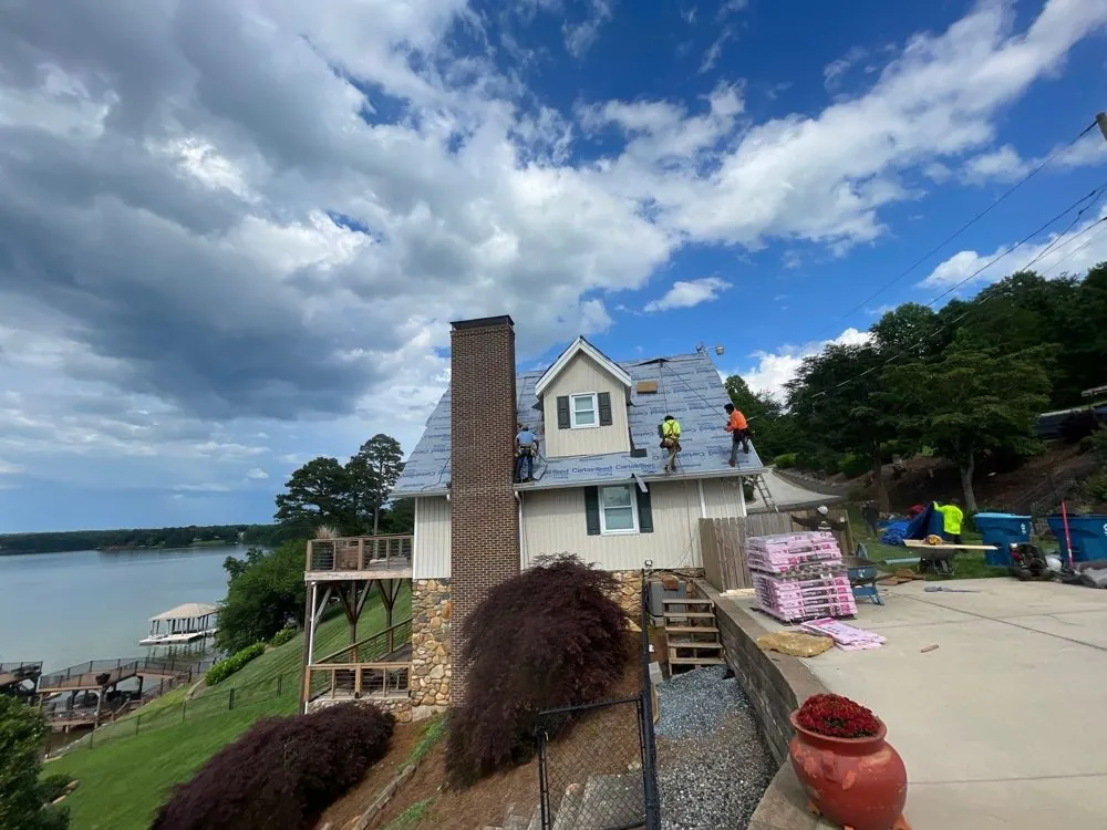 Completed residential roof with new drip edge and gutters, Hickory NC